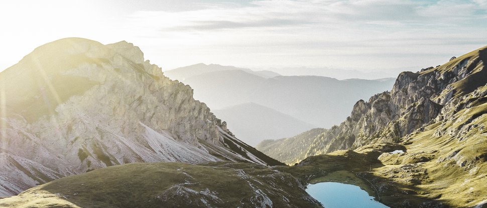 Current news and stories from Olang Sunrise over mountainous area with clear lake in the middle