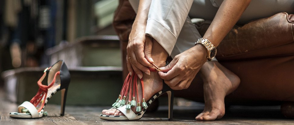 Current news and stories from Olang Woman sitting and fastening stylish high-heeled shoes