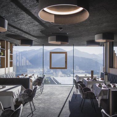 A look at our wine list Modern restaurant with mountain view through large windows