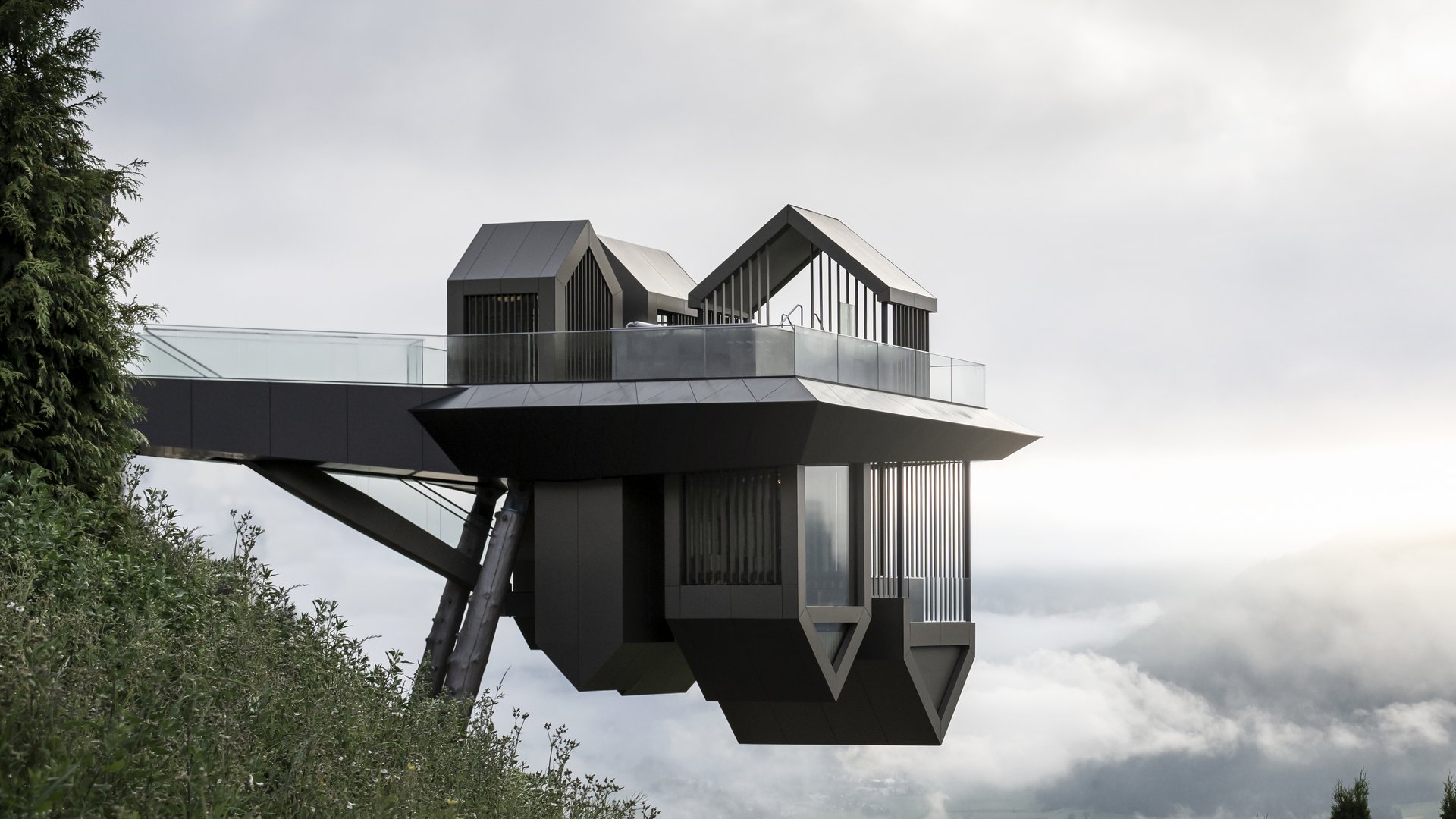 Our Sky Pool in South Tyrol, a rare beauty Modern viewing platform on stilts overlooking misty valley and mountains