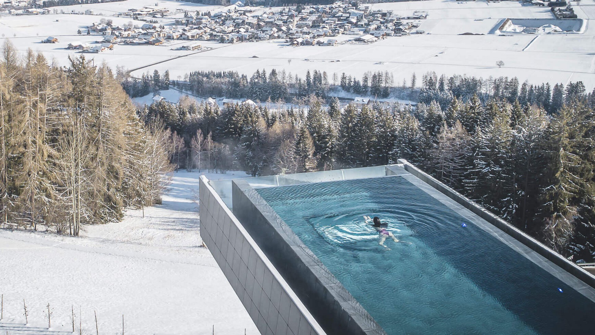 Our Sky Pool in South Tyrol, a rare beauty Swimming pool with mountain view in winter with snowy landscape
