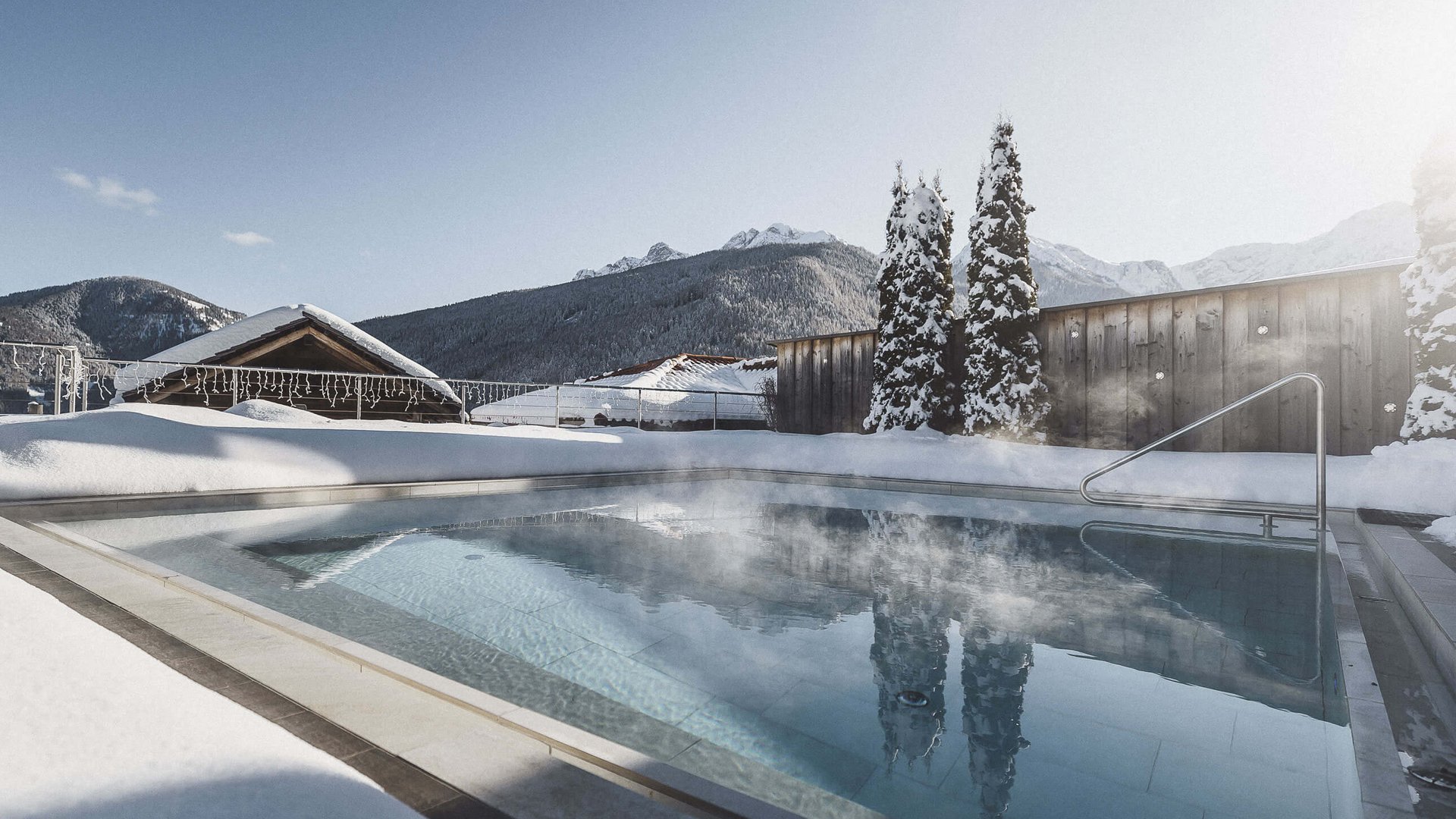 Our Sky Pool in South Tyrol, a rare beauty Heated outdoor pool with snowy scenery and mountain backdrop in winter